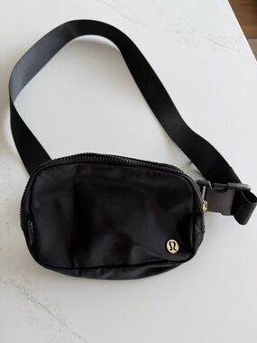 lululemon athletica Black  Waist Pack with GOLD logo and zipper - Like New